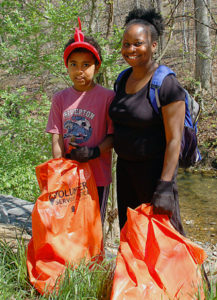 Mother and daughter at a sweep the creek event