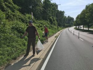 Picking up trash along University Boulevard's new bike lanes.