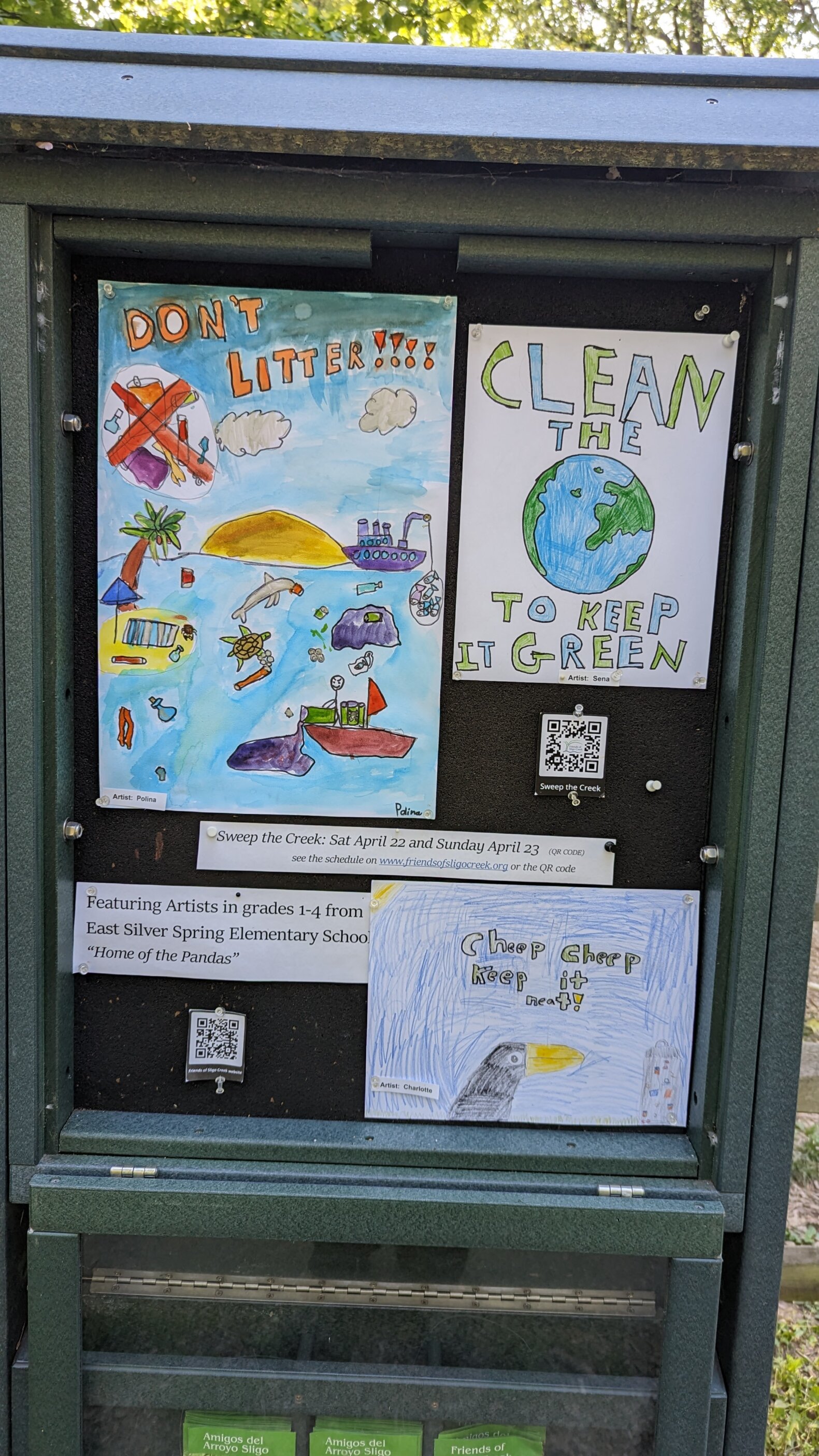 Section 2 Kiosk exhibiting students' artwork about Sweeping the Creek of litter.