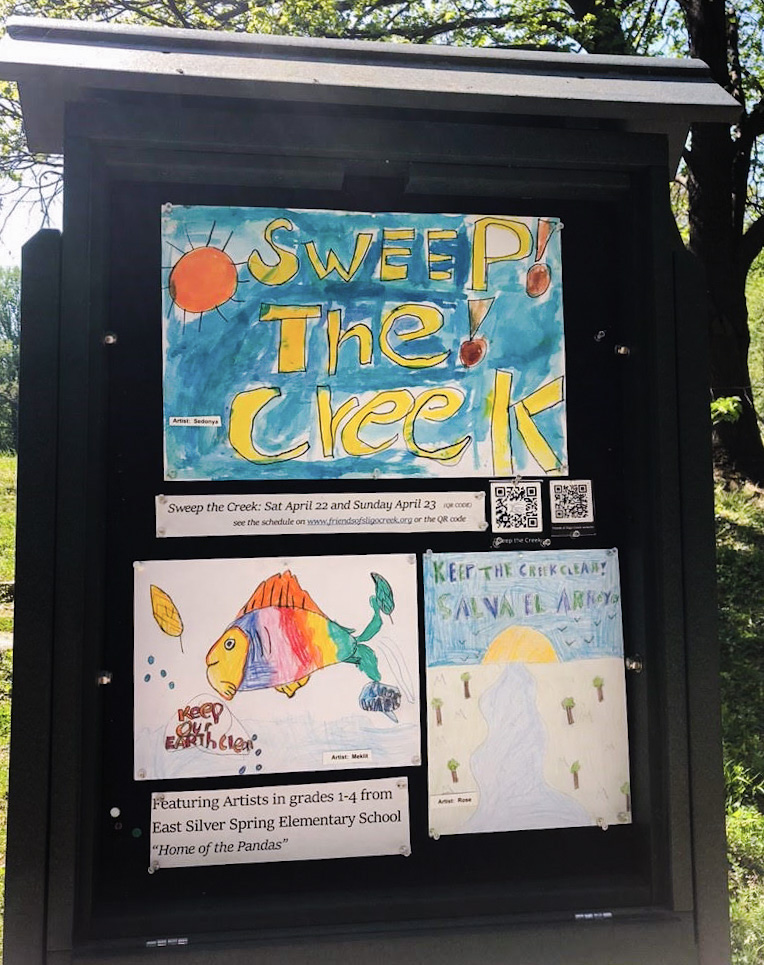 Section 8 Kiosk exhibiting students' artwork about Sweeping the Creek of litter.