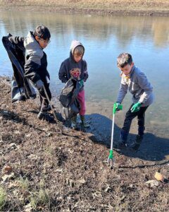 Kids picking up litter at the Wheaton Branch ponds on President's Day 2024