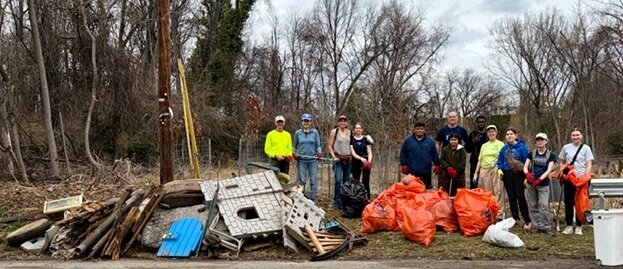 Some the volunteers who cleaned up more than 1,000 pounds of trash at Indian Spring local park and restoration site on March 8, 2026.
